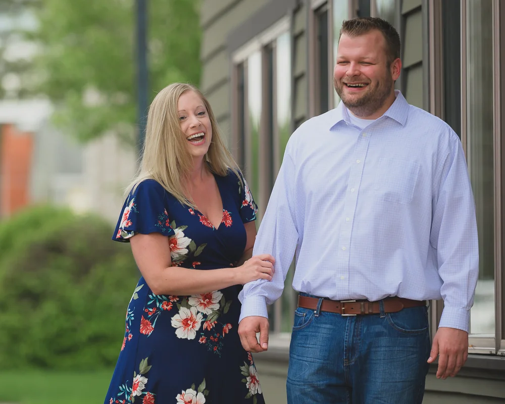 Engagement photos in downtown Goshen Indiana. Outdoor urban photos in Shanklin Park by wedding photographer.