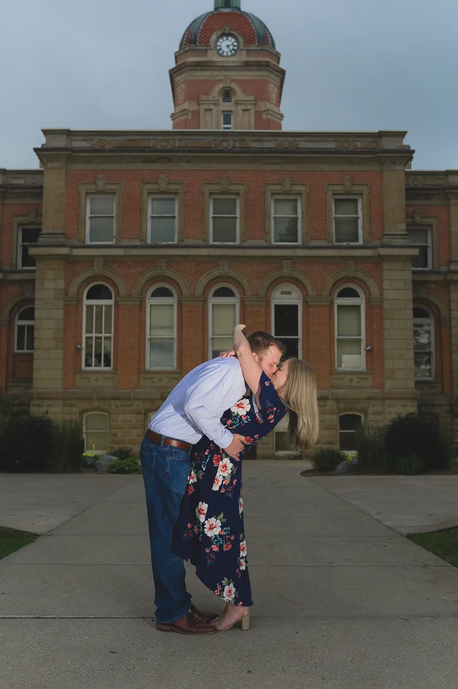 Engagement photos in downtown Goshen Indiana. Outdoor urban photos in Shanklin Park by wedding photographer.