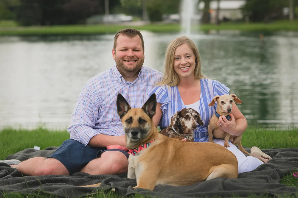 Engagement photos in downtown Goshen Indiana. Outdoor urban photos in Shanklin Park by wedding photographer.