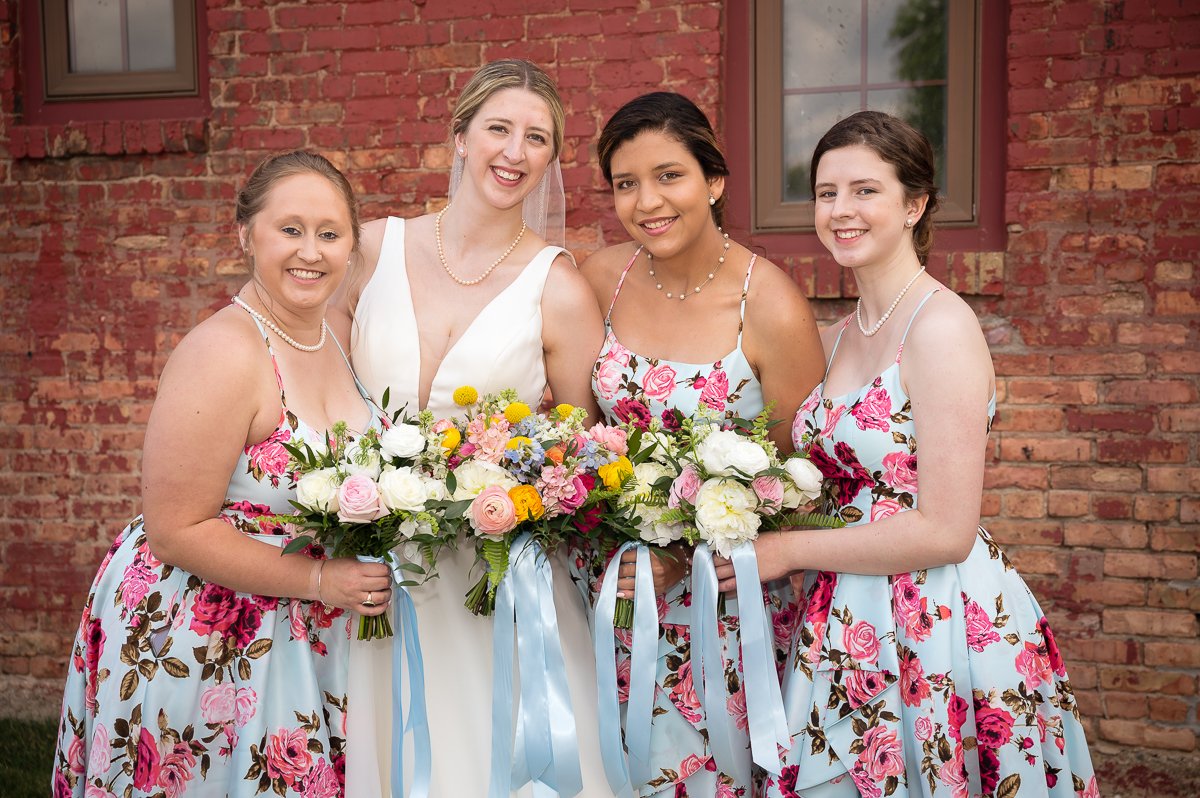 Floral bridesmaids dresses in light blue and pink