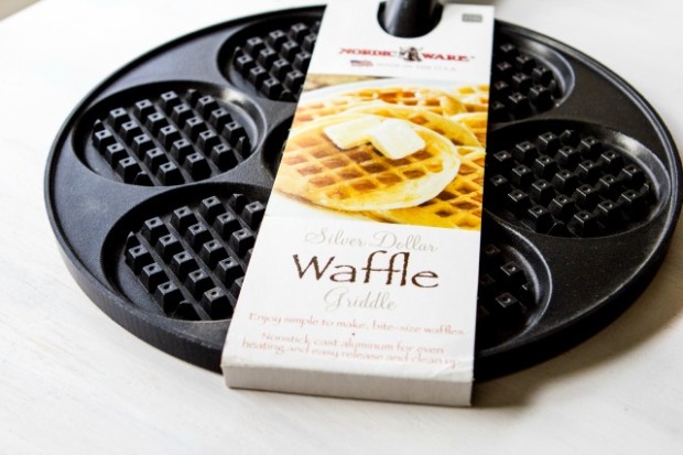 THIS PAN I’ve been totally freaking over waffles lately. They’re all I want to eat. Like, all the time. I want waffles for breakfast and waffles for dinner. I want waffles for dessert and waffles at midnight, when I should be sleeping instead of thinking about waffles. This is a hard obsession to obsess about, when you’ve gone and given up gluten, beans, flours, and other stuffs that tend to make good waffles. Paleo breakfast foods typically use a magical combination of fibrous bananas and eggs to make crepes and pancakes. But put that batter into a waffle pan and you’ve just got a bubbly mess. At least, that’s what happened until I discovered two paleo-fabulous finds at Harmons this week. (Mantra break: Forgive me Father, for I am just now coming to appreciate my local Harmons for the gourmet grocery goodness that it harbors inside). So, this pan. This NordicWare Silver Dollar Waffle Griddl e now makes waffles simple, easy, and in totally perfect sizes. When I say I want a waffle, I don’t really want a whole, goddamned waffle. I just want three bites. Three bites of nom, three bites of syrup. And in proper cases, three bites of bacon. Most waffle irons are too big to give me what I want. They’re just behemoths in the world of breakfast food. And thus I’ve left my waffle iron withered and lonely in the back pantry for sometime now. But this pan officially changes everything. It heats evenly, makes teeny waffles, and stored itself simply with my other pans. (Mantra break: Oh, Silver Dollar Waffle Griddle, j’adore.)