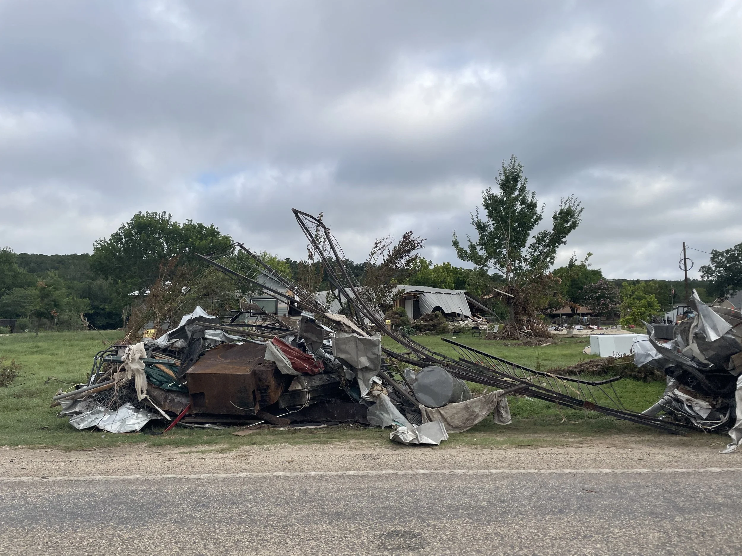 Debris pile outside my friend's former house, August 2025