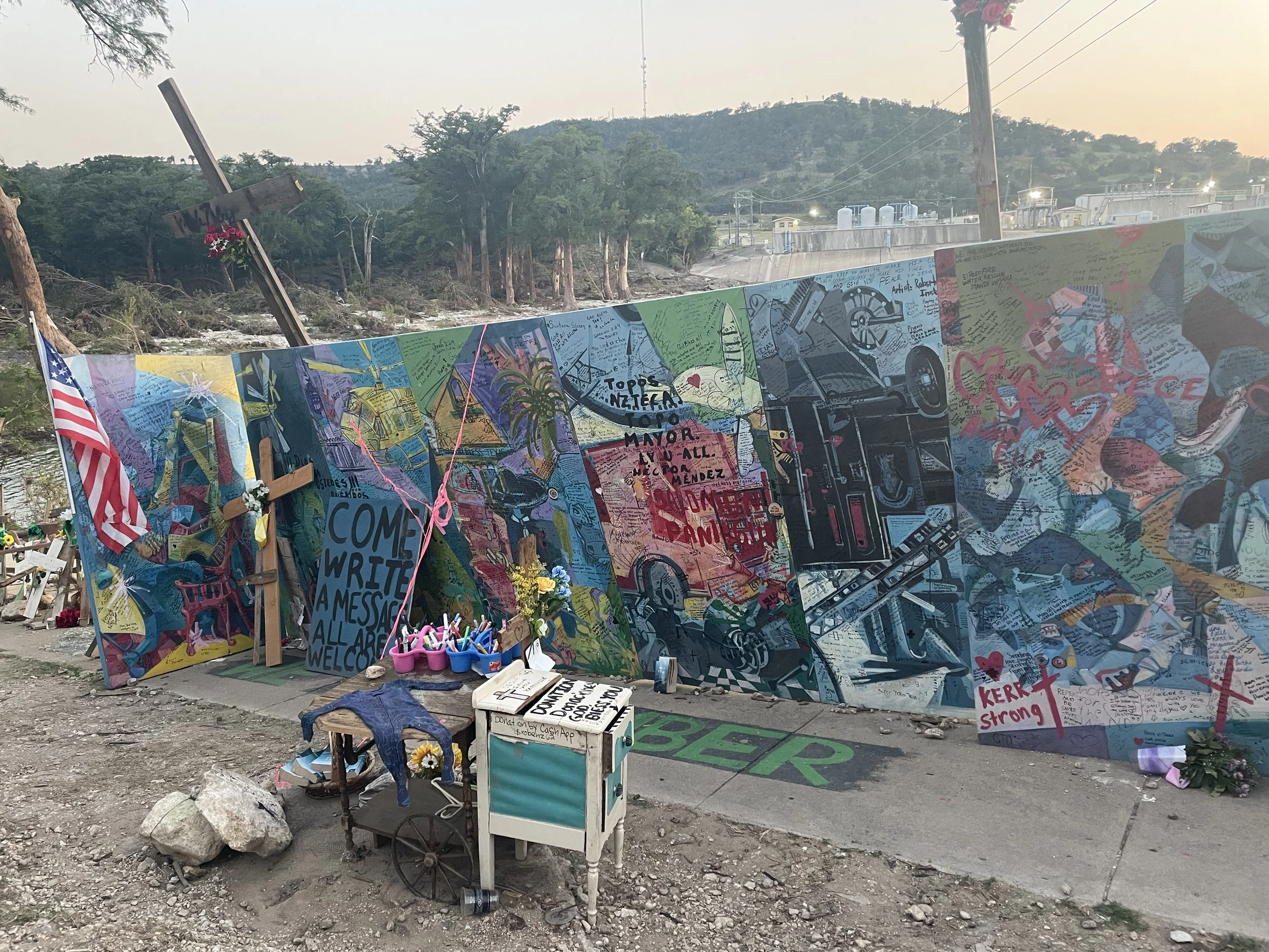 Participatory memorial initiated by artist Roberto Marquez, Guadalupe River Park, Kerrville, TX, August 2025