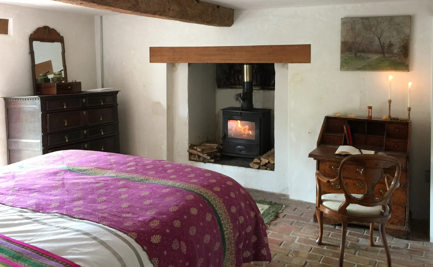 Bedroom 2: downstairs double bedroom with view out towards the woodland. Original brick floor and woodburner. Downstairs shower room. Bedroom 3: Has its own private deck and a zip and link double bed converting to a twin if need be.