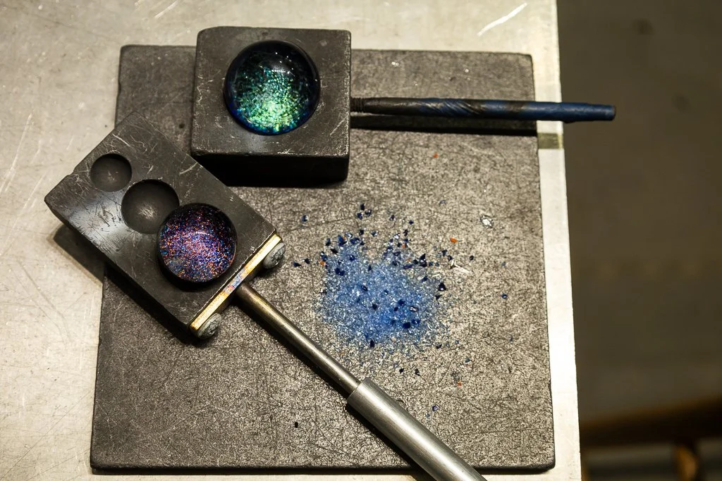 Blown glass dichroic marbles made in glassblowing studio in flameworking class in pittsboro north carolina