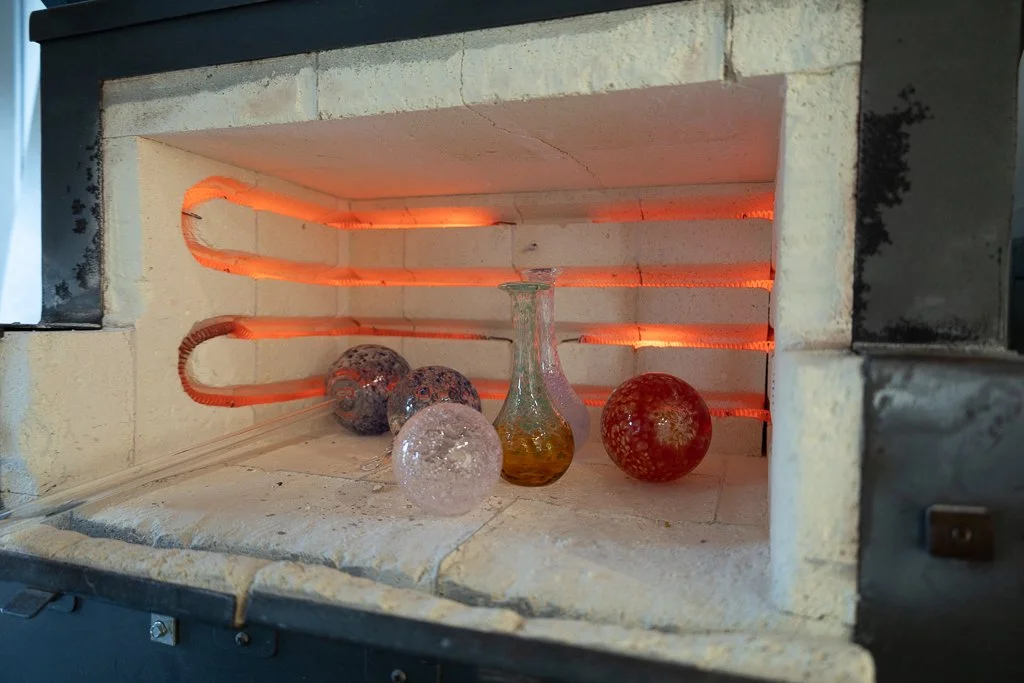 blown glass in kiln during glassblowing class in flamewoking studio