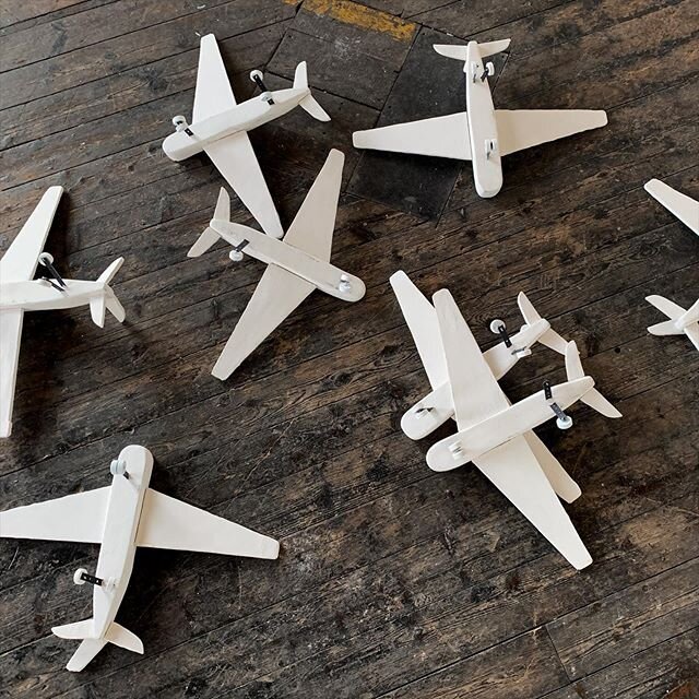 a view from above of belly-up
airplanes made of plaster, concrete, metal, etc.