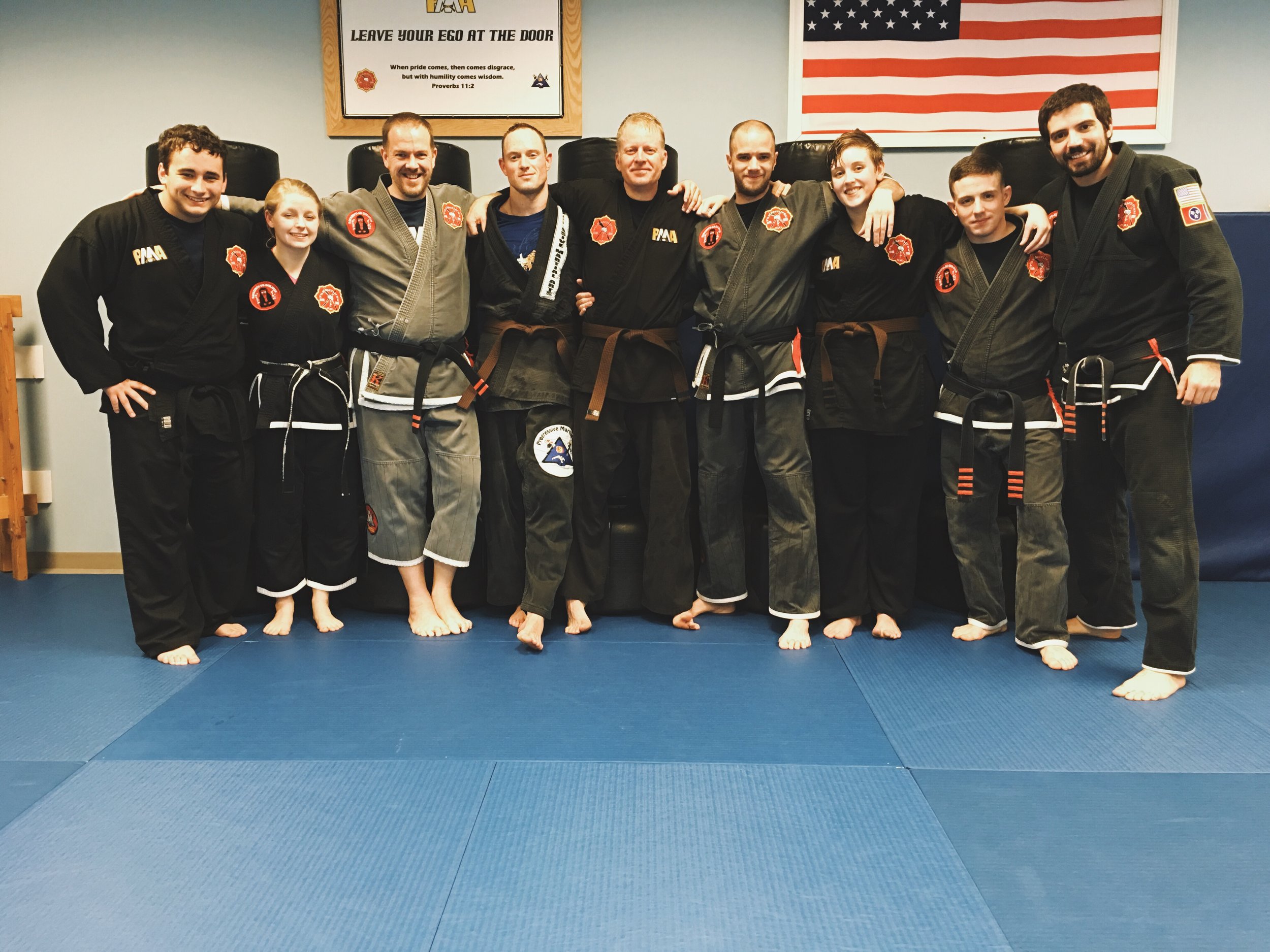 Gary (pictured in middle) with some of his instructors and training partners at Progressive Martial Arts Academy.