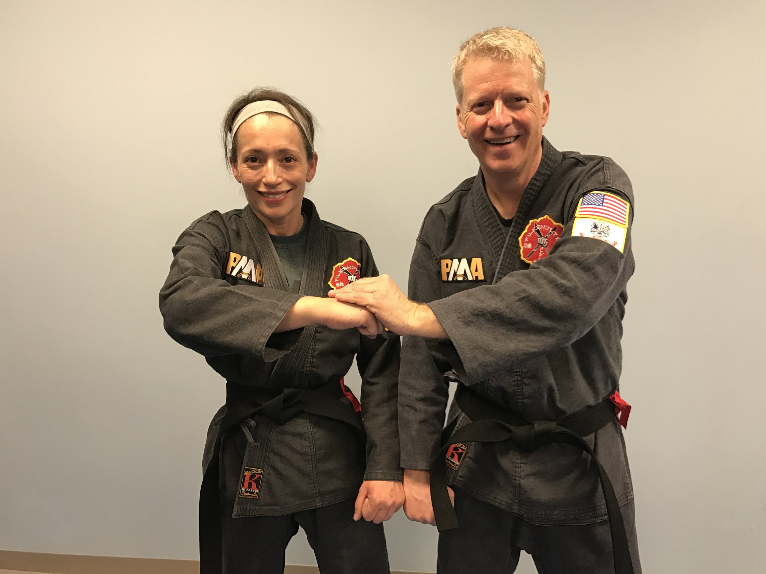 Linda with her Black Belt Test partner, Gary Hall.
