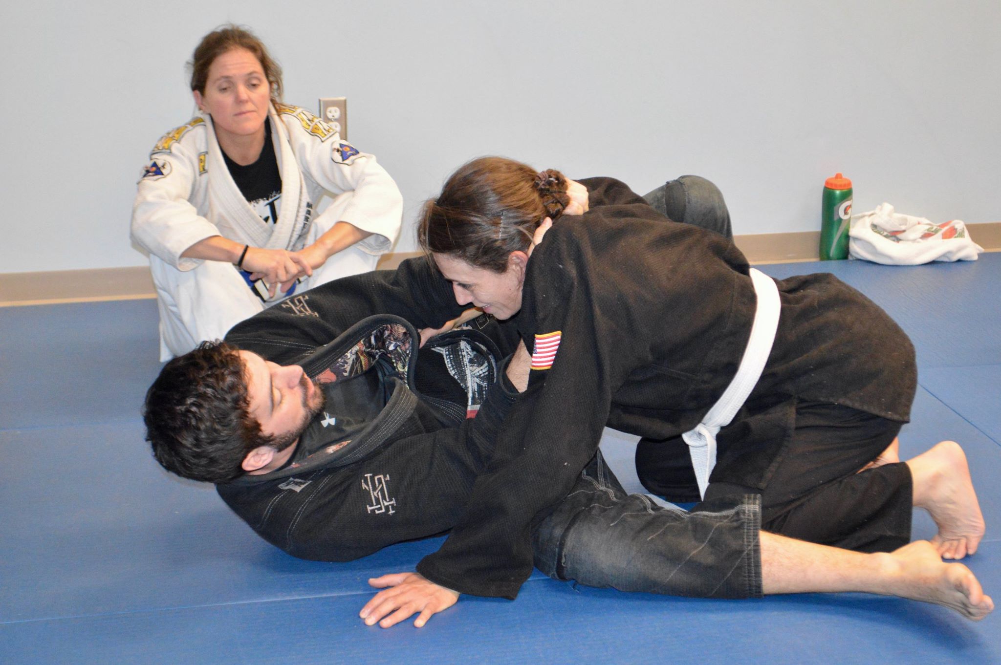 Linda learning a Jiu Jitsu technique from her teacher.