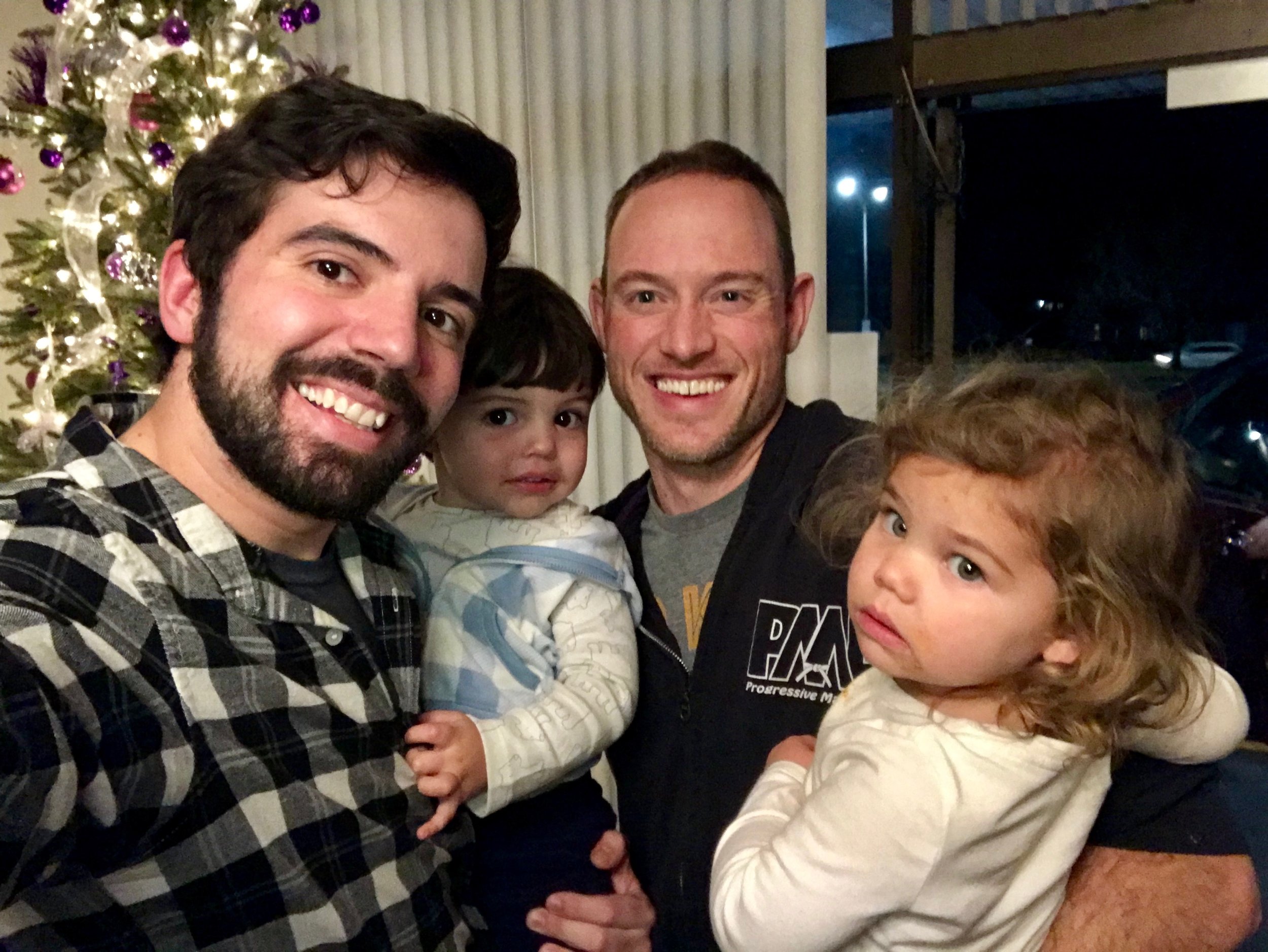 Sempai Matt and his daughter, Wylie, alongside his instructor, David Corrigan, and his son, Auggie. Wylie and Auggie shared the same due date!
