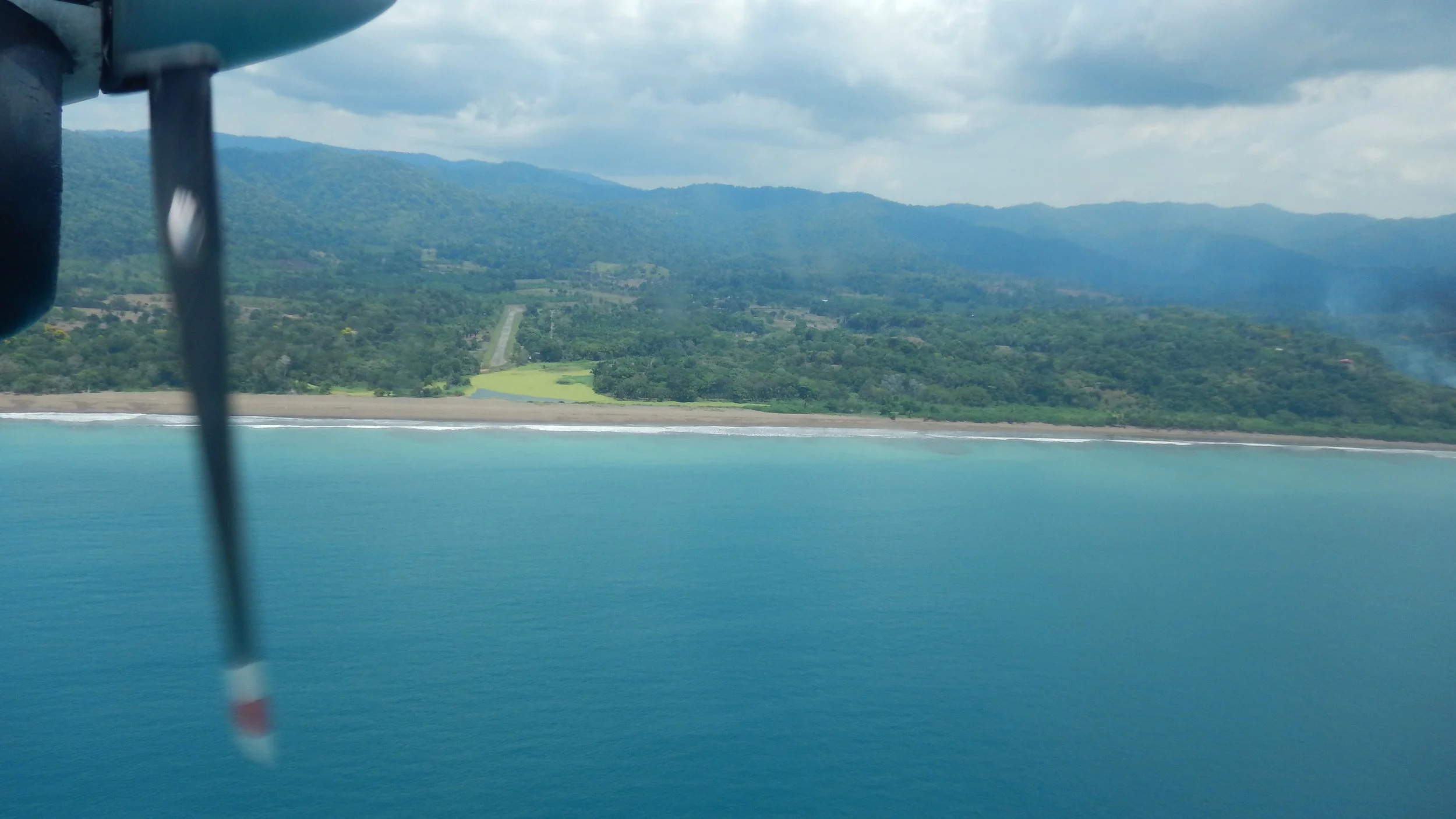 That tiny strip just off center is the landing strip at Drake Bay. If you over shoot it it's into the ocean. The beaches are grey from the volcanic sands.