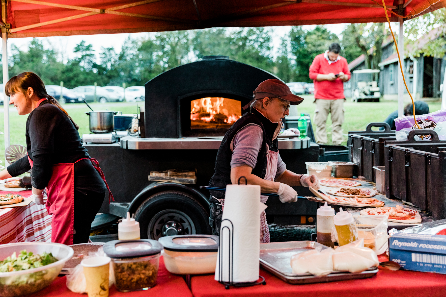   DO: Consider a mobile caterer, such as brick oven pizza! Everyone loves pizza. However, with a mobile company you will likely need to add a supplemental catering company to take care of trash removal, moving tables, and more. So think carefully.   