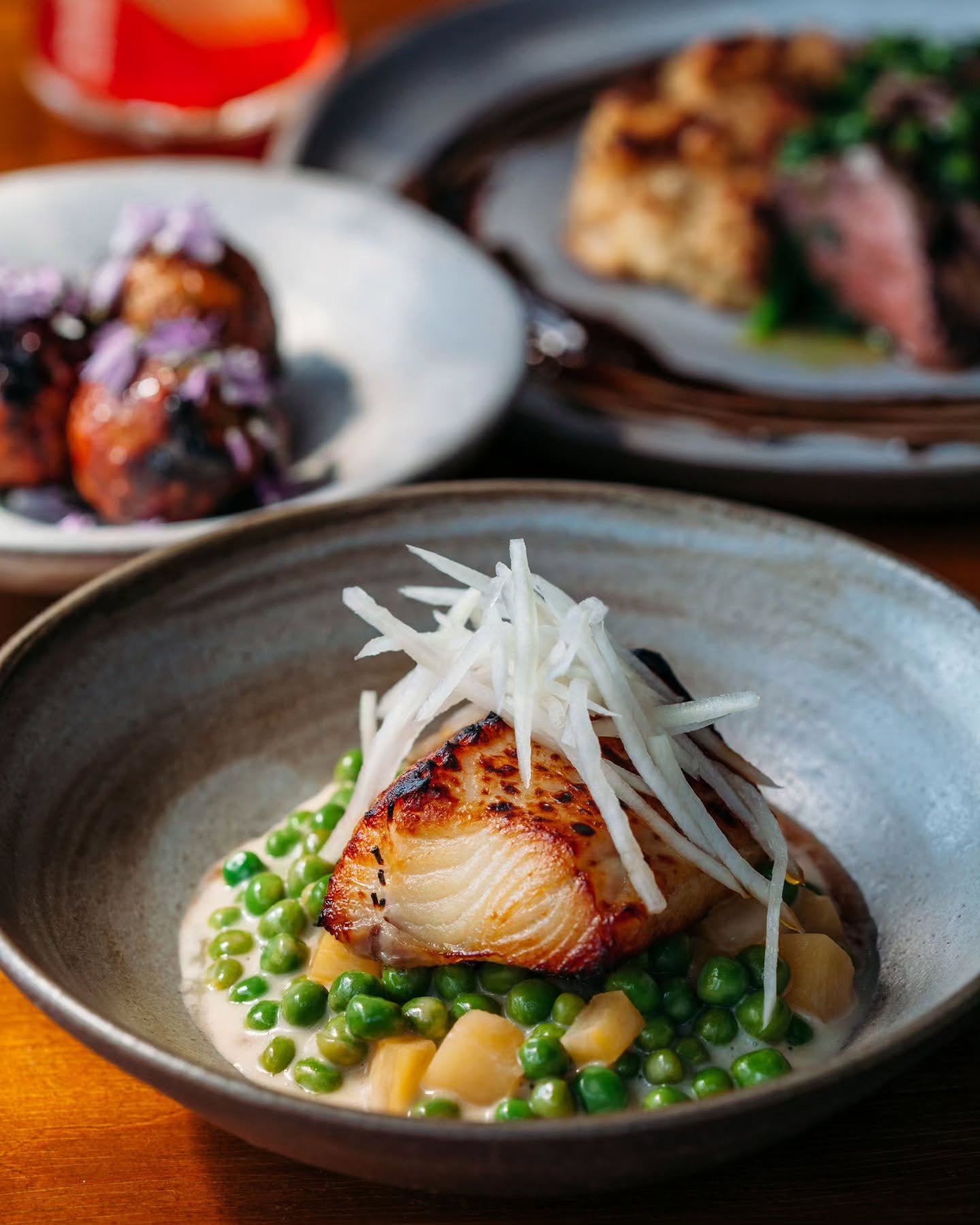 Broiled black cod, daikon, turnips, peas, kimchi.

📷: @qpo