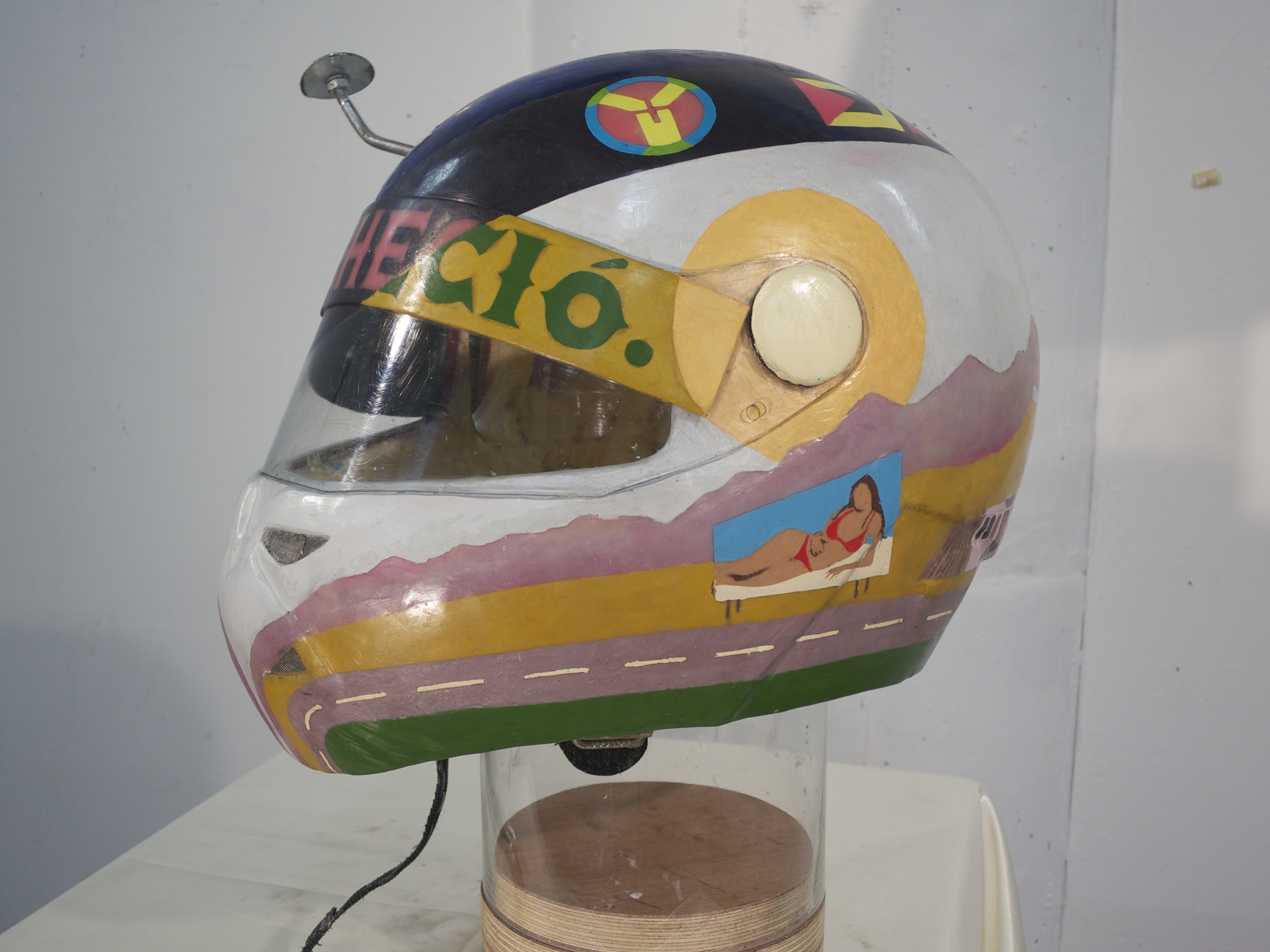   y en sus ojos anocheció, &nbsp;2012.  Modified motorcycle helmet, Bondo resin, natural Peruvian (Andean) dyes, beeswax, dammar resin, encaustic pigments, expanding foam.&nbsp;  12.5" x 17" x 15" 