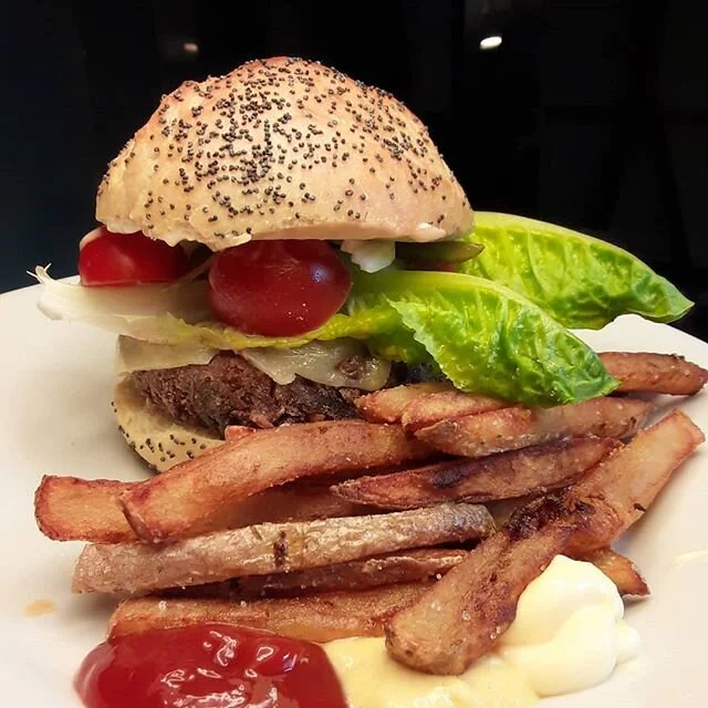 Quarantine veggie burger: homemade poppy seed sourdough potato bun (more in pic 2), patty (berb&egrave;re lentils, mushrooms, walnuts, spiced butter, egg, breadcrumbs, flour), melted sheep and cow cheese, romaine, cherry tomatoes, raw onion, cornicho