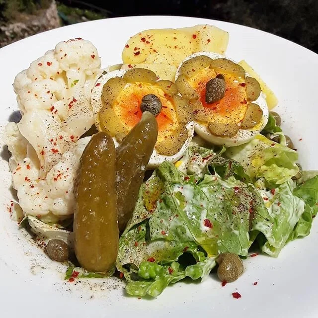 That's a funny looking salad 👀🤣: obviously boiled eggs (maybe went a little overboard cartoony/50s?), cornichon, capers, cauliflower, potatoes, romaine lettuce. Dressing: cucumber fermented in my milk k&eacute;fir, k&eacute;fir, mustard, mayo, oil,