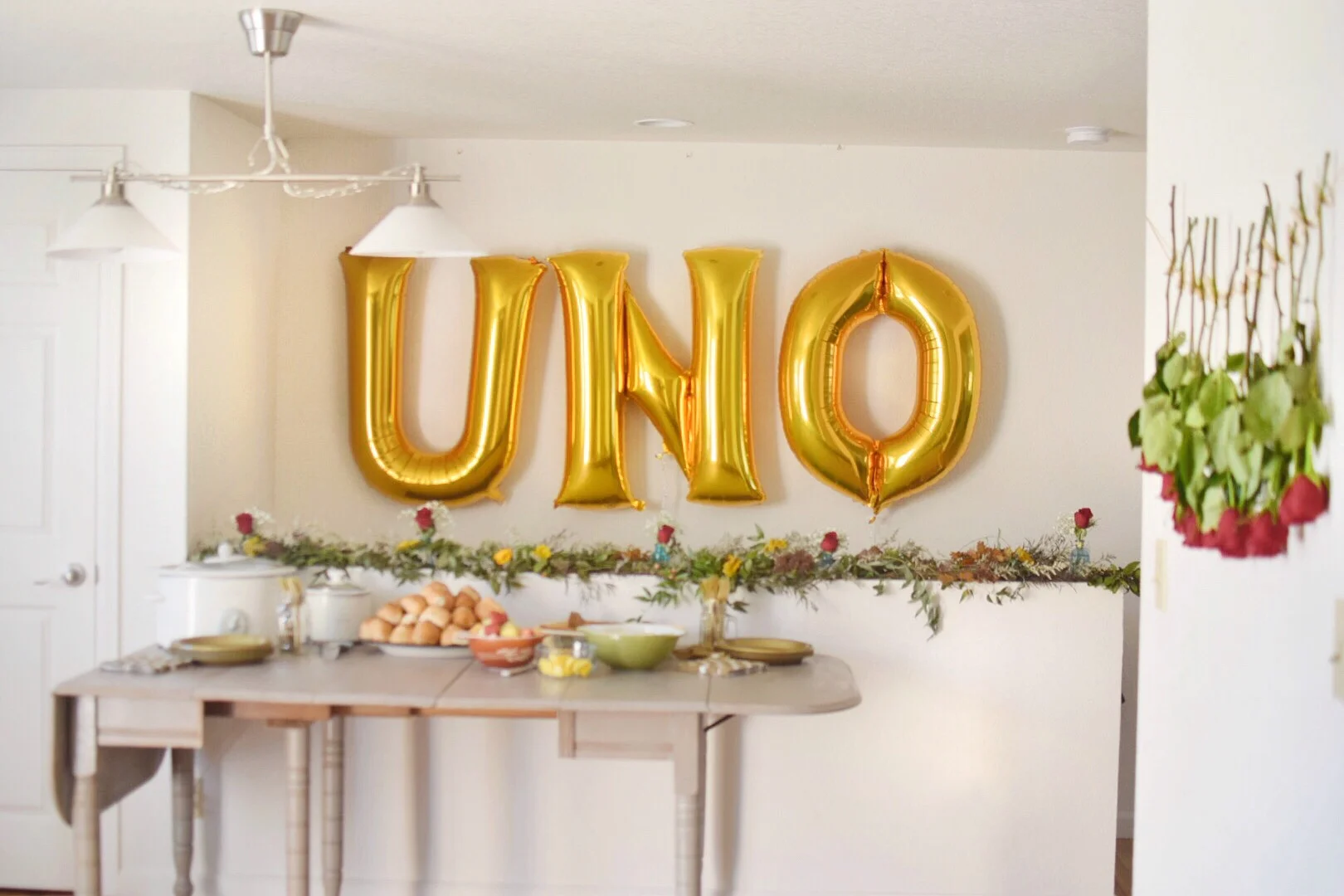 A first birthday party idea: Get large balloons to make a statement! To make things easy on us, we had a pot luck with breakfast goodies complete with a Bloody Mary bar. I think we earned those drinks! The first year of raising a human is no joke :)