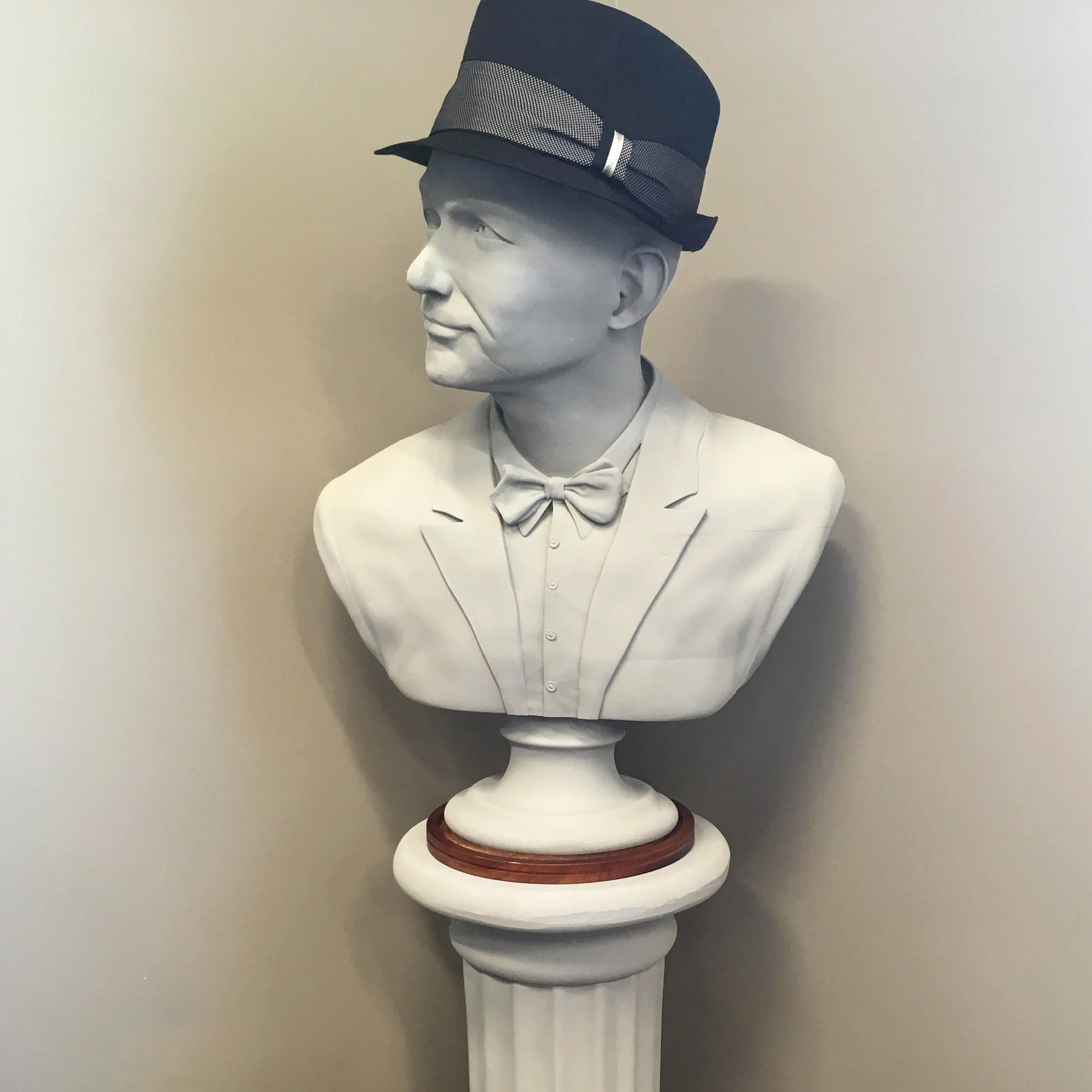 Frank Sinatra 3d printed bust painted wearing Sinatra's original hat stranding on a column podium