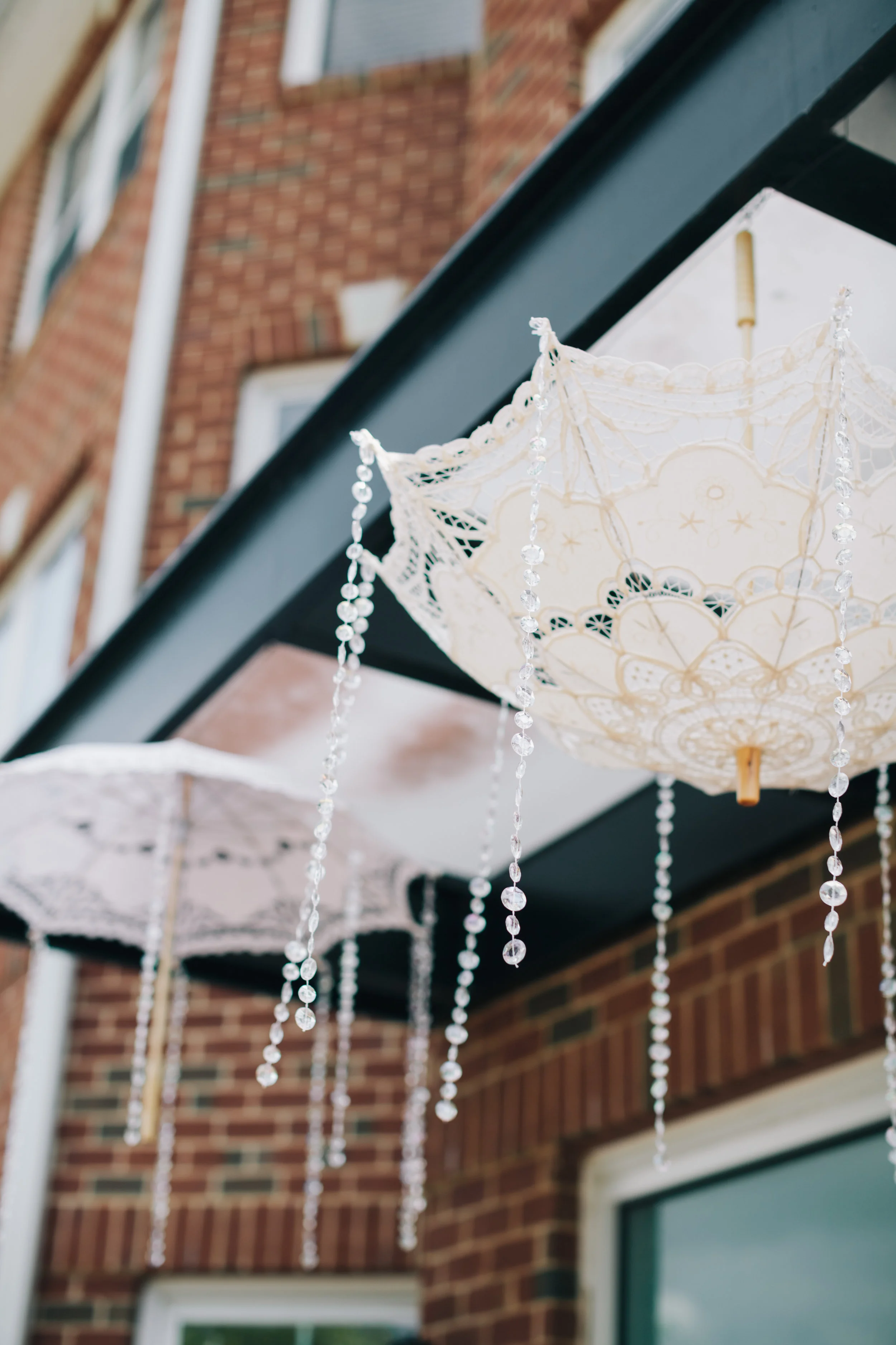 Lace parasols were hung above the entrance