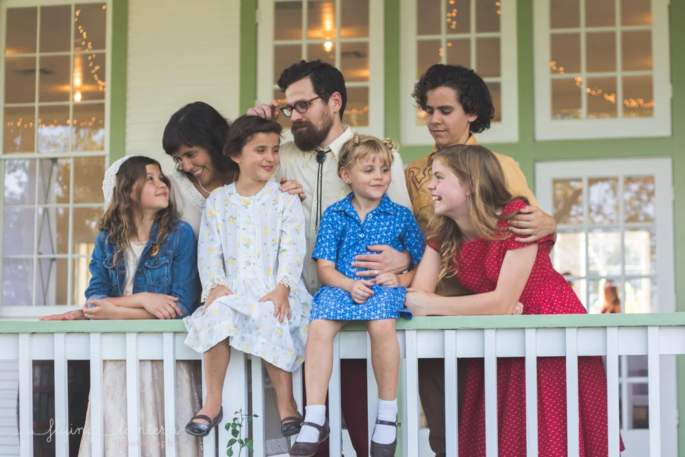 family of seven portrait looking at each other
