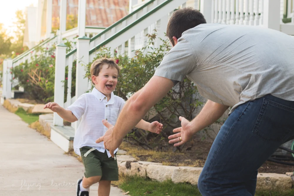 three year old boy running to dad