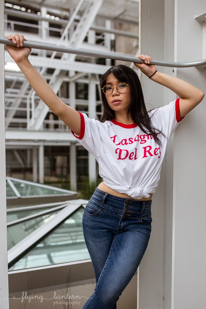 girl portrait in austin, texas at seaholm district wearing jeans and shirt at boiler nine photo by erin reas of flying lantern photography