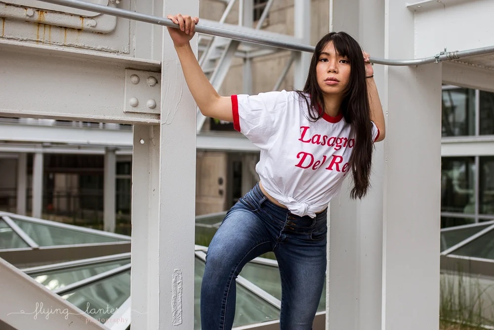 girl portrait in austin, texas at seaholm district wearing jeans and shirt at boiler nine photo by erin reas of flying lantern photography