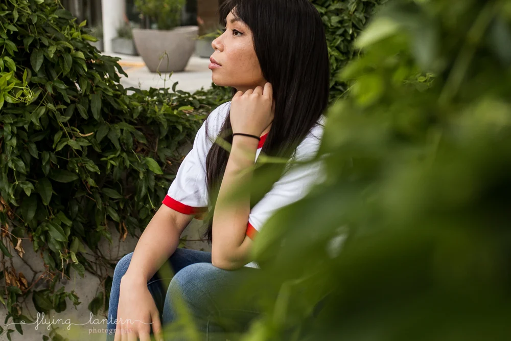 girl portrait in austin, texas at seaholm district wearing jeans photo by erin reas of flying lantern photography