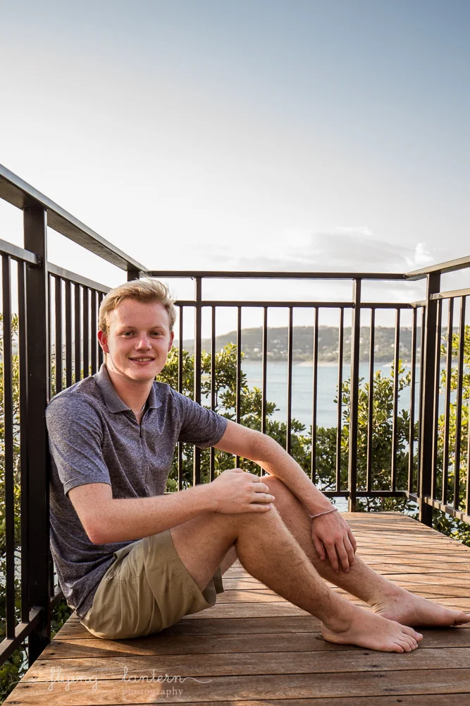 Extended family session on Lake Travis during family reunion. high school senior male. Photo by Erin Reas of Flying Lantern Photography