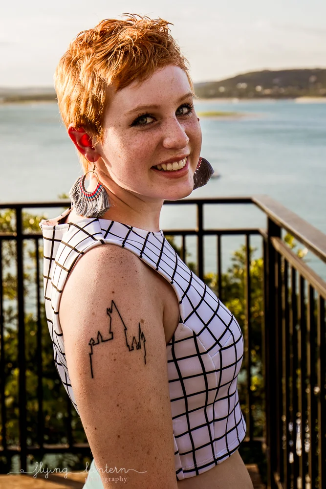 Extended family session on Lake Travis during family reunion. senior portrait female with short hair and hogwarts tattoo. Photo by Erin Reas of Flying Lantern Photography