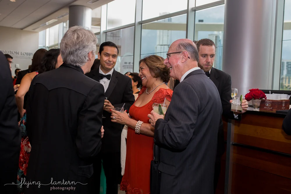 Guests laughing at the Authentic Mexico Gourmet Gala. Event photography by Erin Reas of Flying Lantern Photography