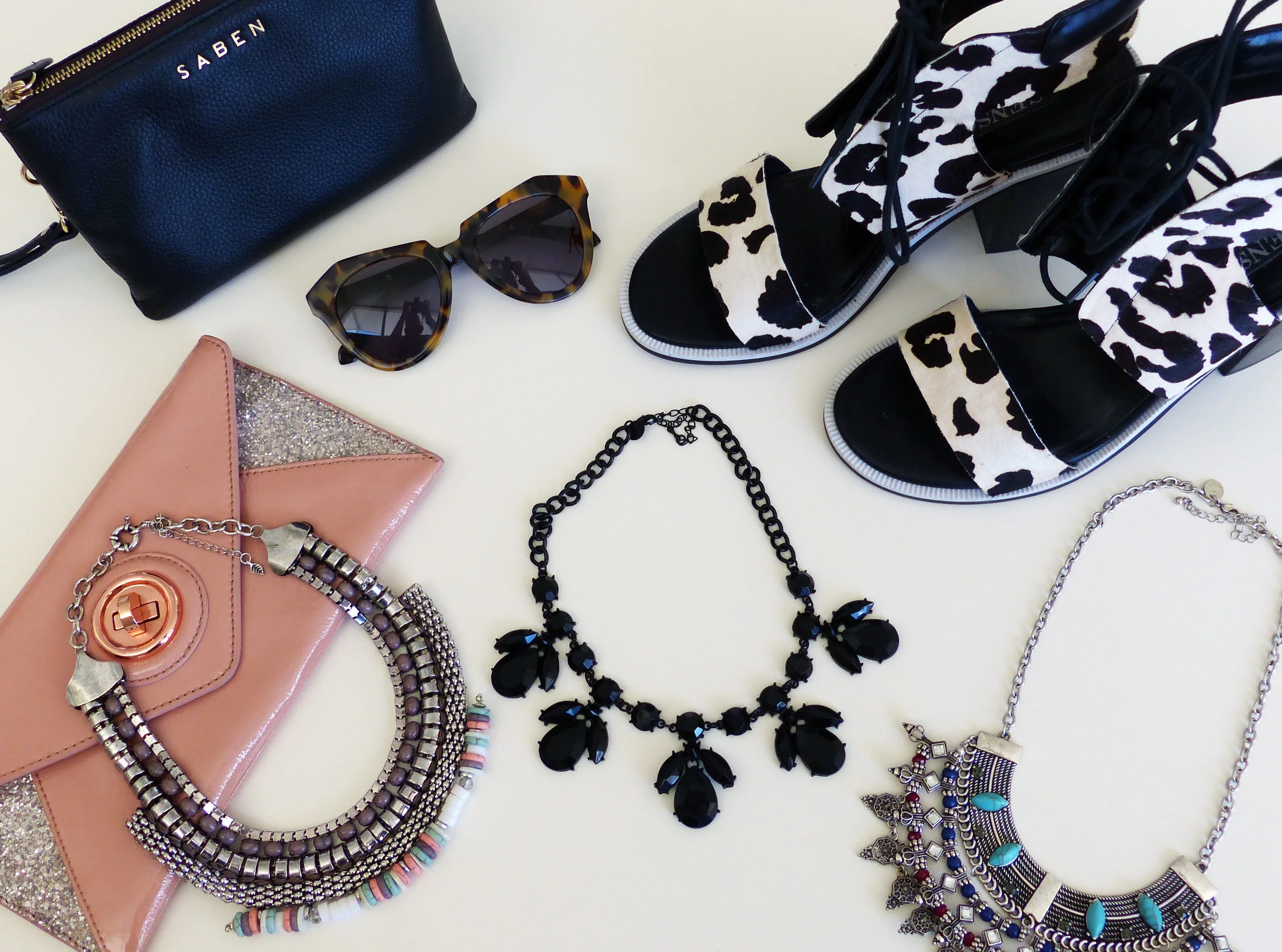 Saben 'Tilly' pouch, Karen Walker sunglasses, Senso heels, Mimco clutch, necklaces by Jeanwest, Lovisa and Equip.