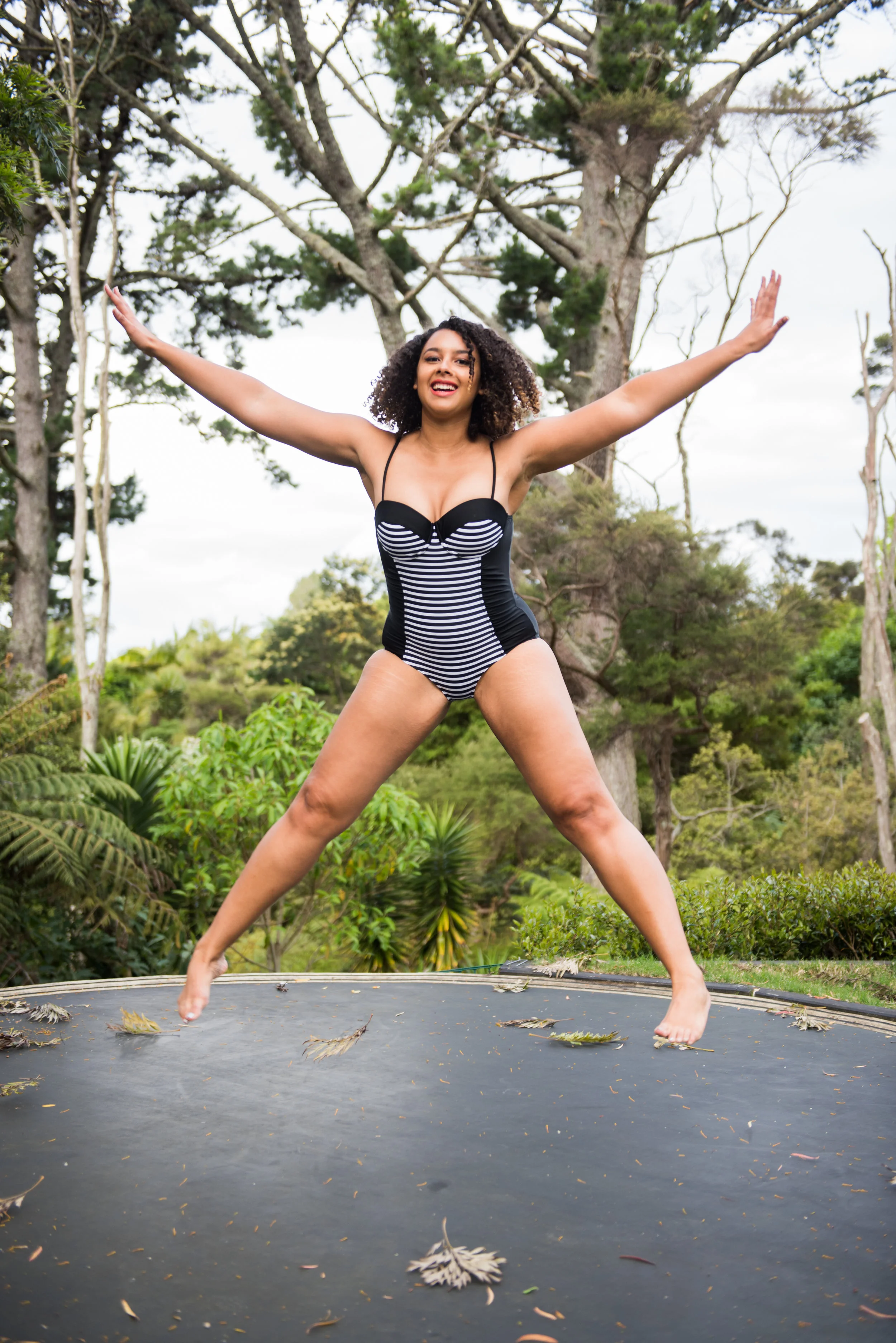 Yup, I'm on a trampoline, in my swimsuit - and I'm happy about it! Photo by Nykie Grove-Eades