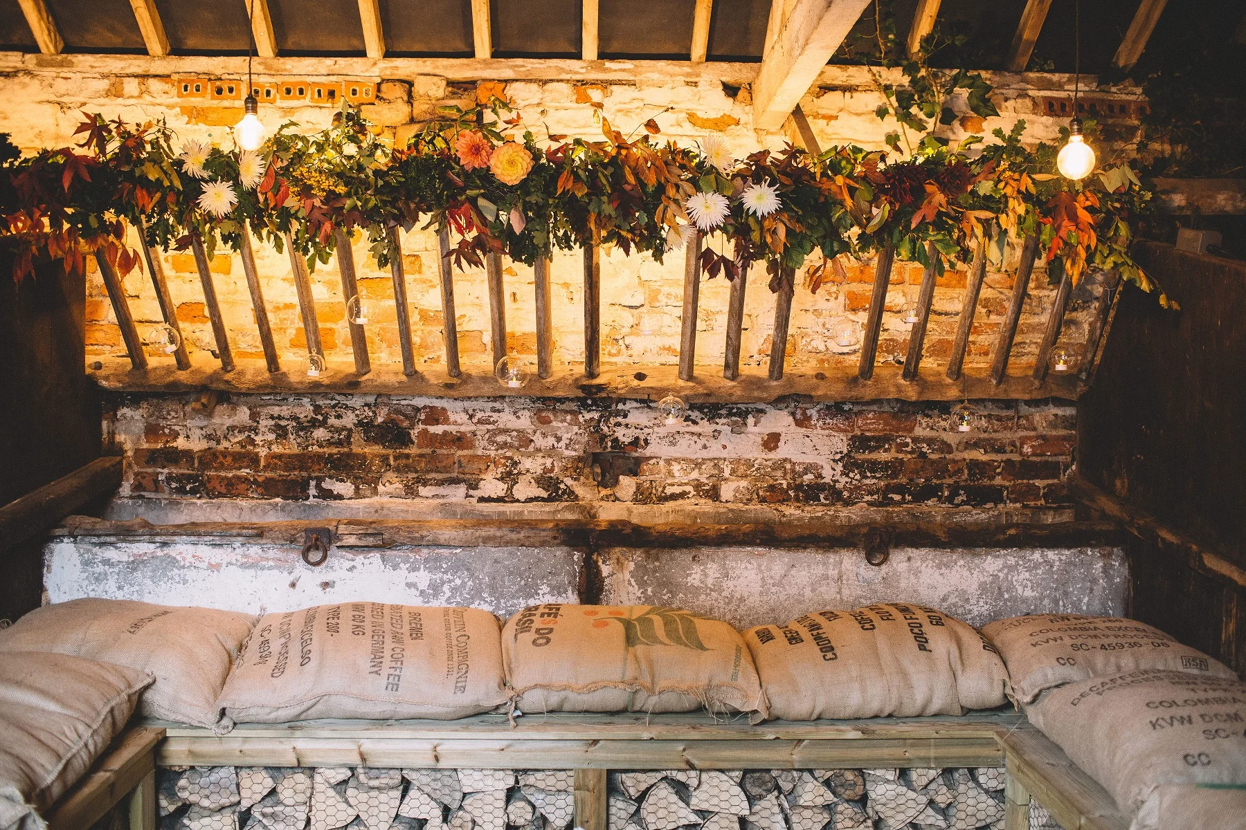 Rachel & Andrew by Lumiere Photographic - the Cow Stalls bedecked in flowers by Clock Dandelion.jpg