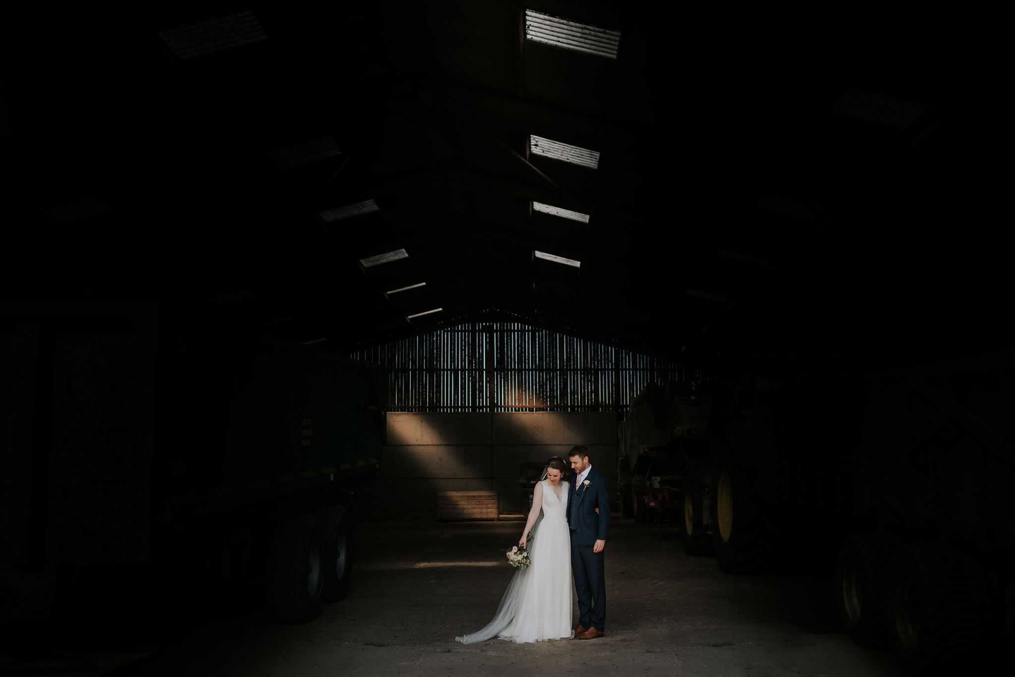 Katie and Rob take cover in a wonderfully lit barn.jpg