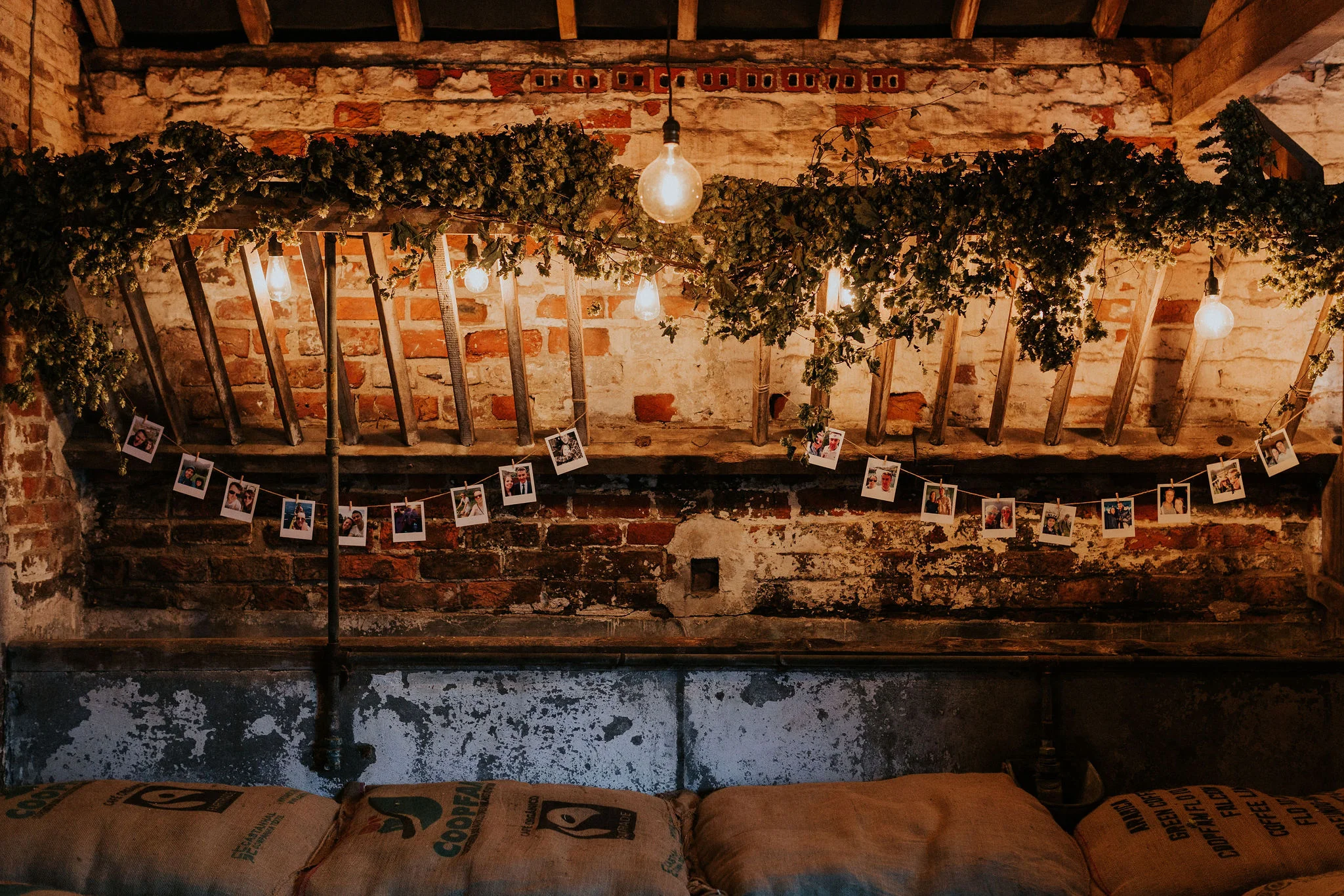 The Cow Stalls mangers decked with hops and embellished with personalised Polaroid-style bunting.jpg