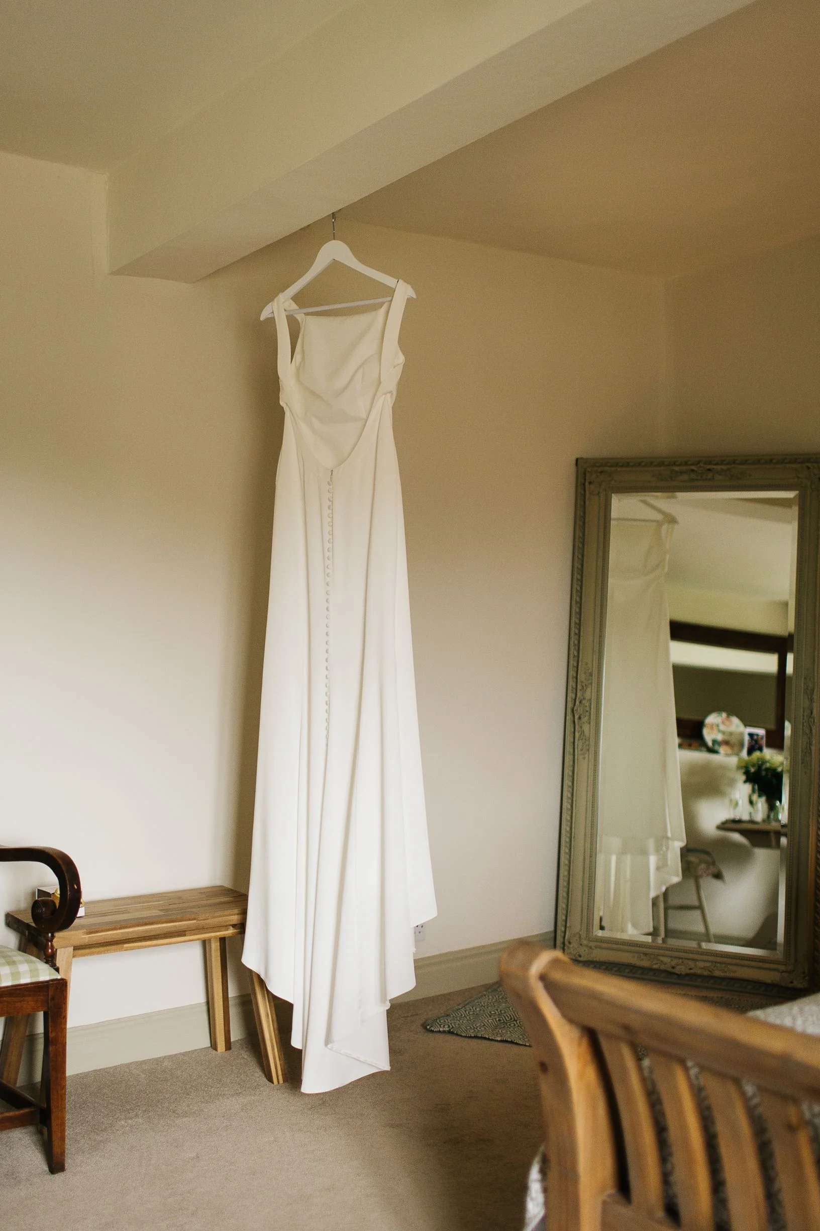 Sarah's stunning dress hanging in The Normans Cottage. Photo by pauljosephphotography.co.uk .jpg