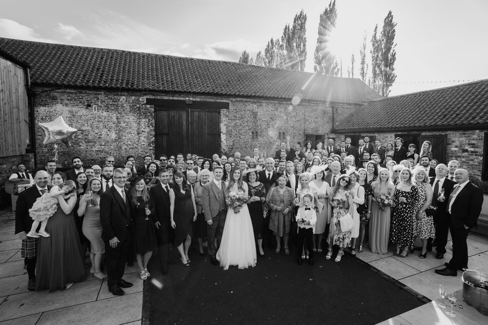 Wedding guest group shot Normans Courtyard. Hamish Irvine Photographer.jpg