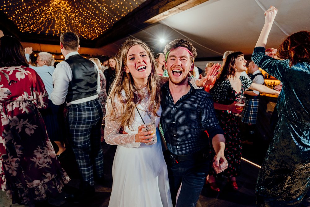 Bride & wedding photographer on The Normans dance floor. Hamish Irvine.jpg