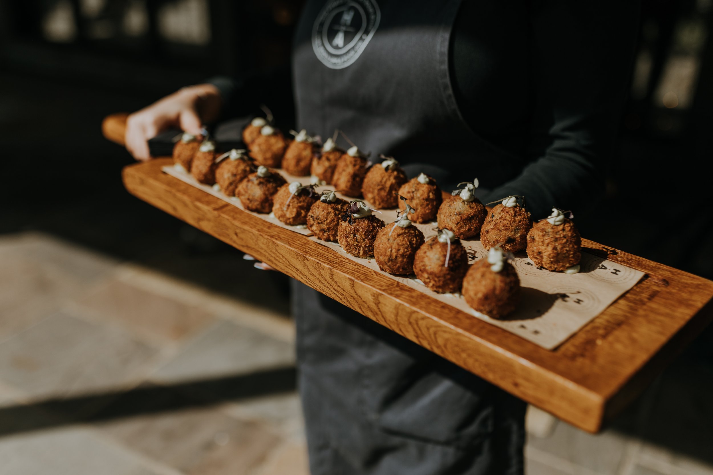 Canapes served during the drinks reception in The Normans wedding venue Courtyard. Photo by Louise Anna Photography.jpg