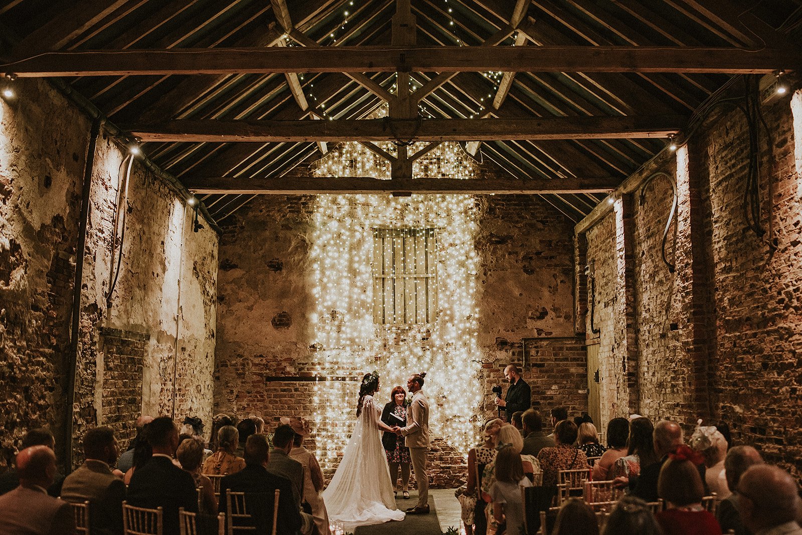 Bride Groom Marriage vows fairy lights in The Normans Ceremony Barn. Shutter Go Click Photography (6).jpg