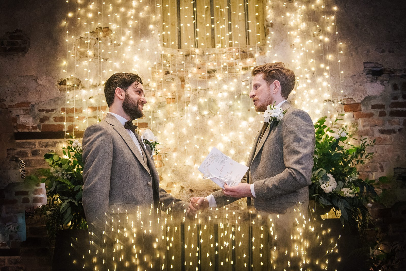 Personalised vows exchanged in front of cascading fairy lights. Photo by Sugarbird Photography.jpg
