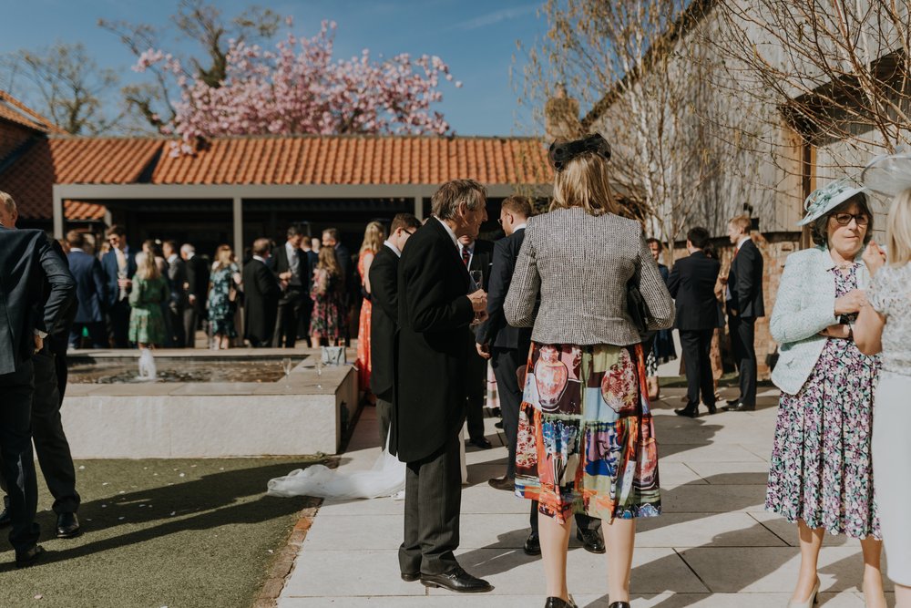 Sunshine and cherry blossom in The Normans wedding venue. Photo by Louise Anna Photography.jpg