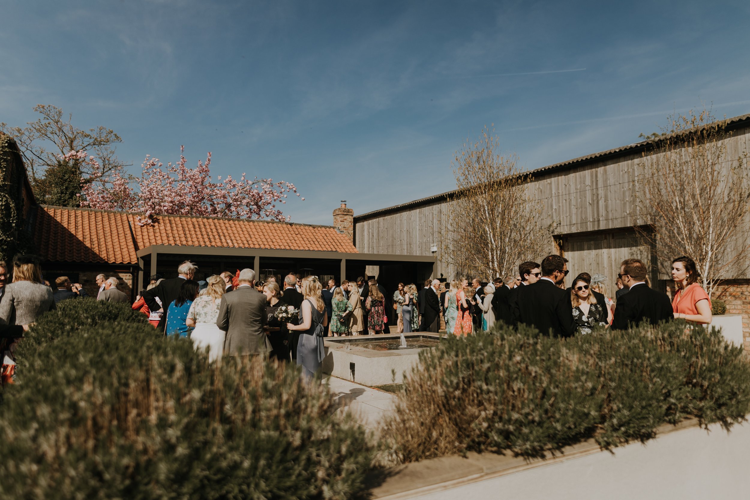 The Normans Courtyard in the Spring sunshine for the drinks reception. Photo by Louise Anna Photography.jpg