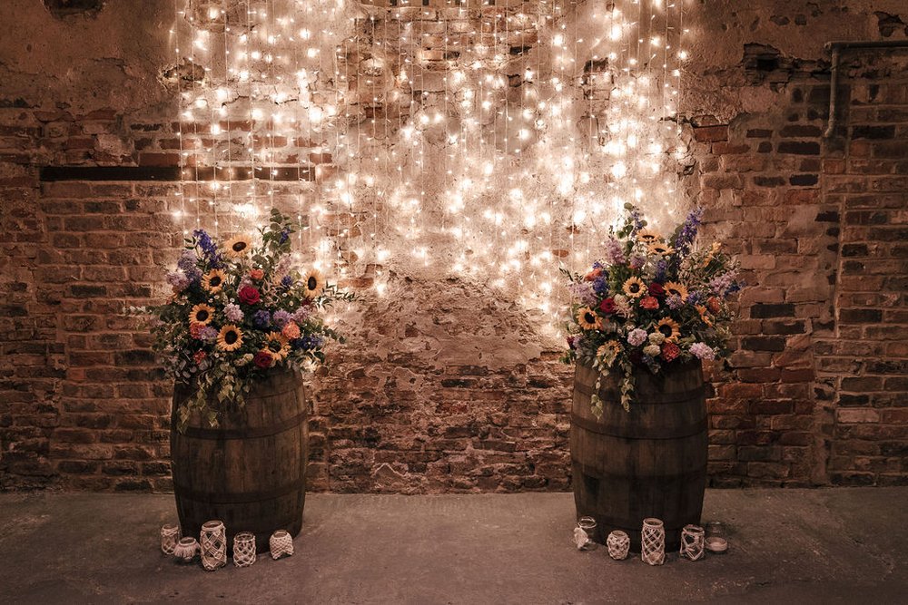 10_Flower arrangements by Petal Studio in The Normans wedding venue Ceremony Barn. Photo by Jules Barron.jpg