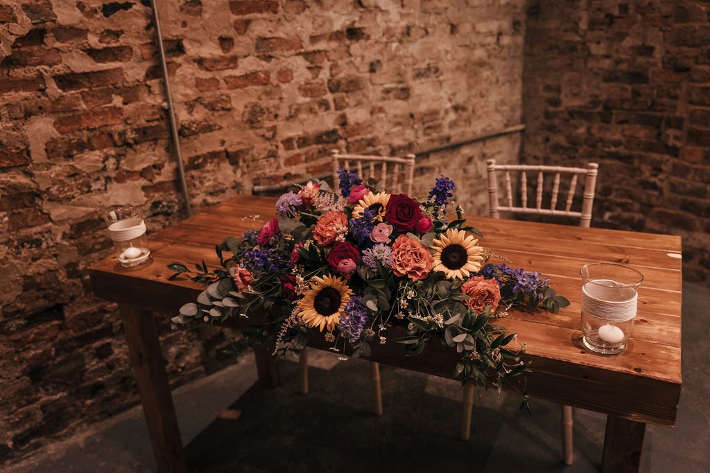 11a_Registrar table and flowers in The Normans wedding venue Ceremony Barn. Photo by Jules Barron.jpg