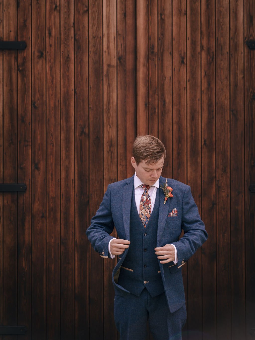 16_Groom suited and booted in The Normans Courtyard. Photo by Jules Barron.jpg