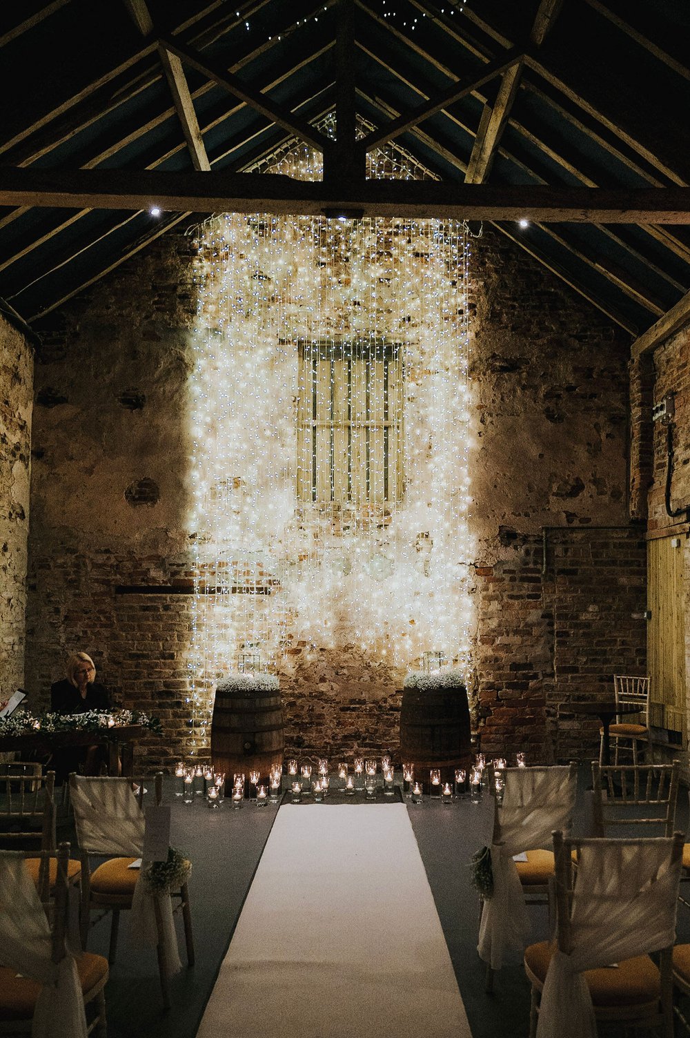 03_White aisle runner and candles in The Normans Ceremony Barn. Photo by Charlotte Whit.jpg