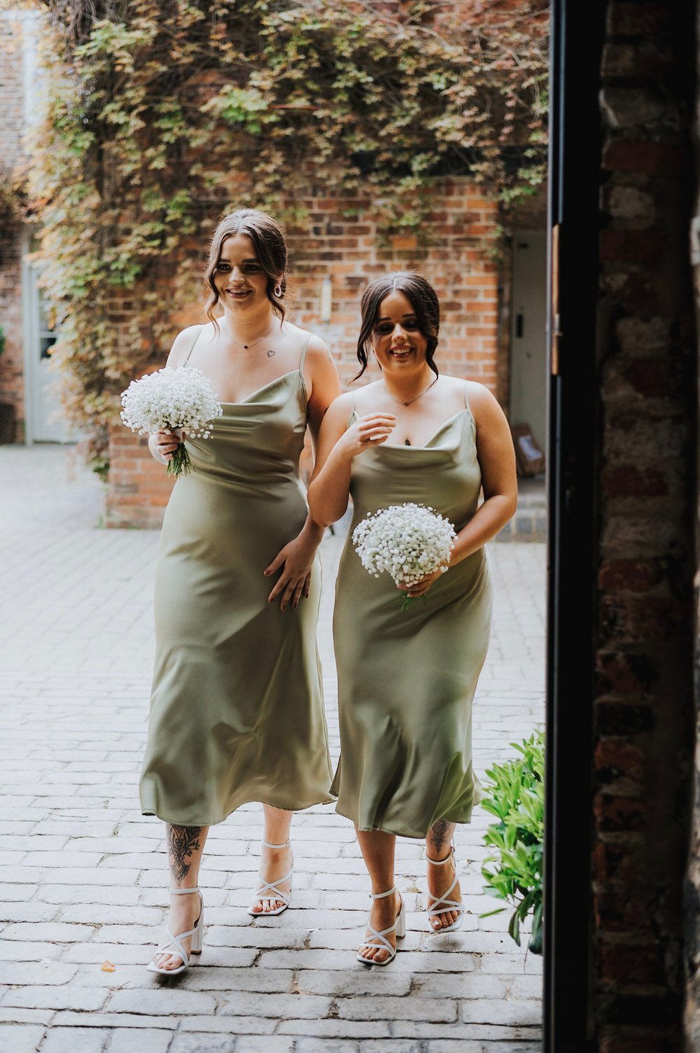 04_Bridesmaids make their way to The Ceremony Barn. Photo by Charlotte White.jpg